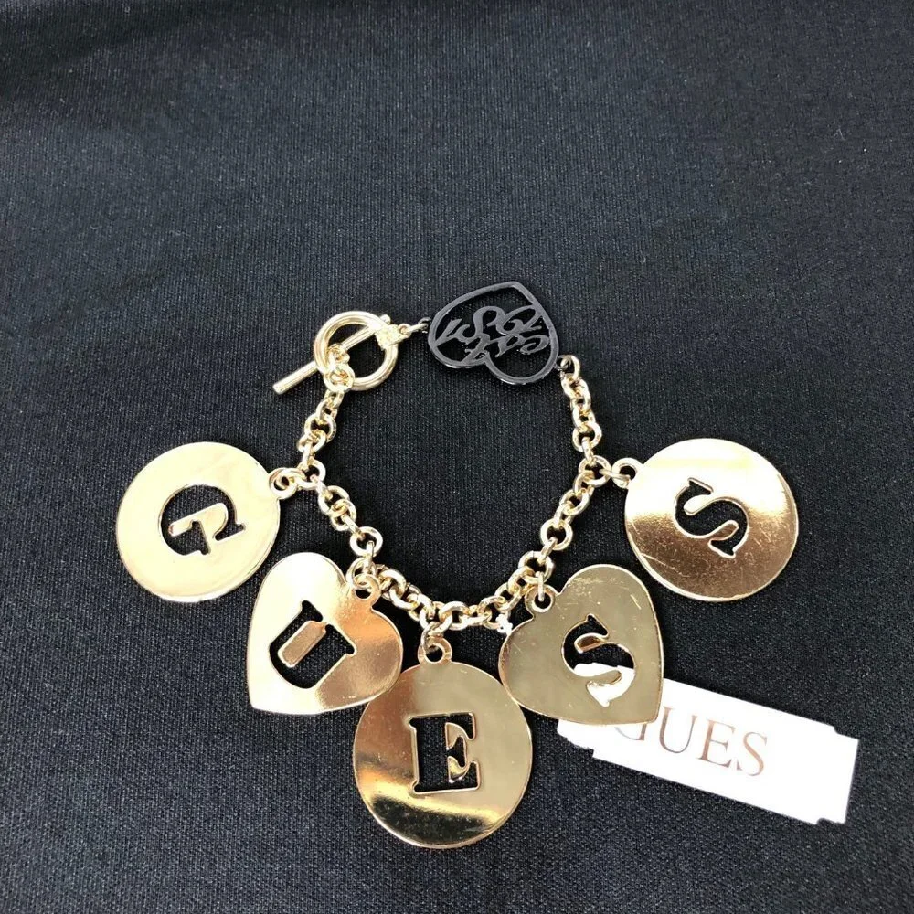 GUESS GOLD TONE LETTER CHARMS 7